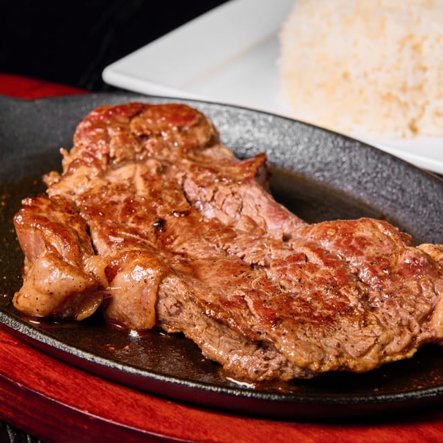 Bistec A La Parrilla - Grilled Steak.